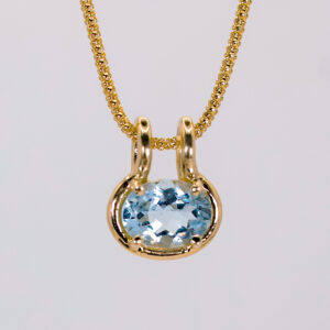 dije de aguamarina oval en oro 14k